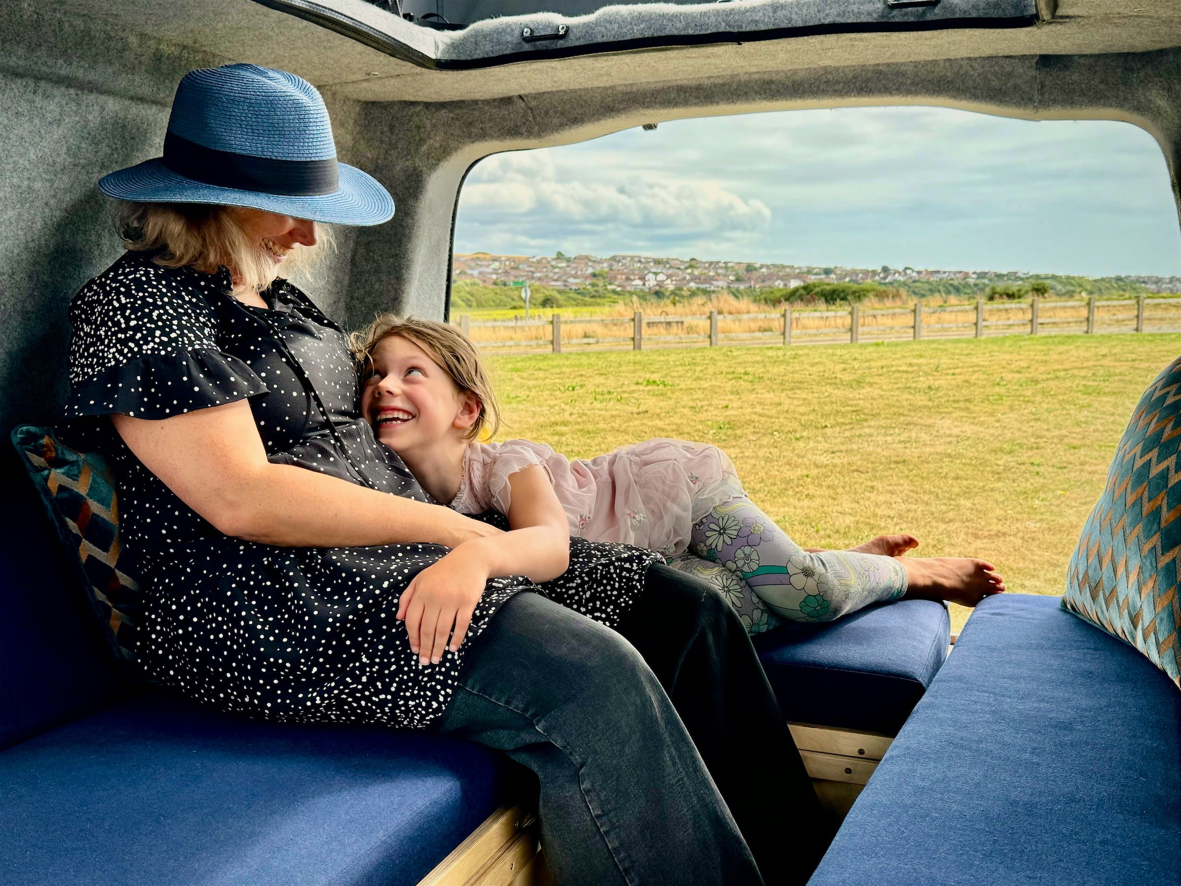A woman and child sat in the Sunbox seating area